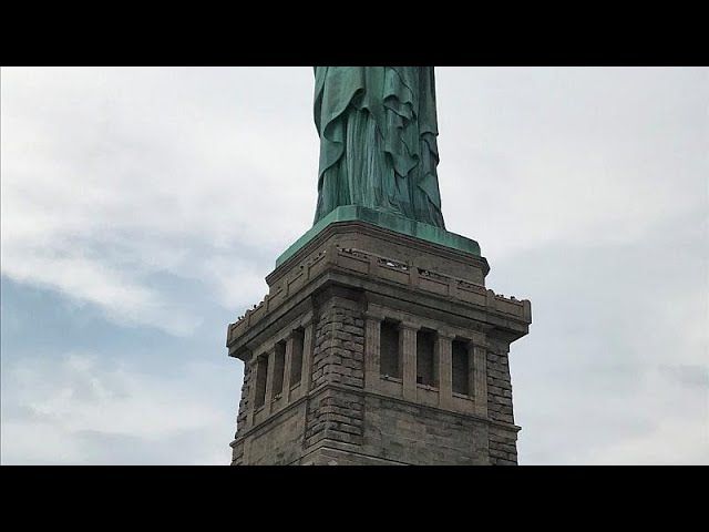 Watch: protester removed from Statue of Liberty after immigration demo