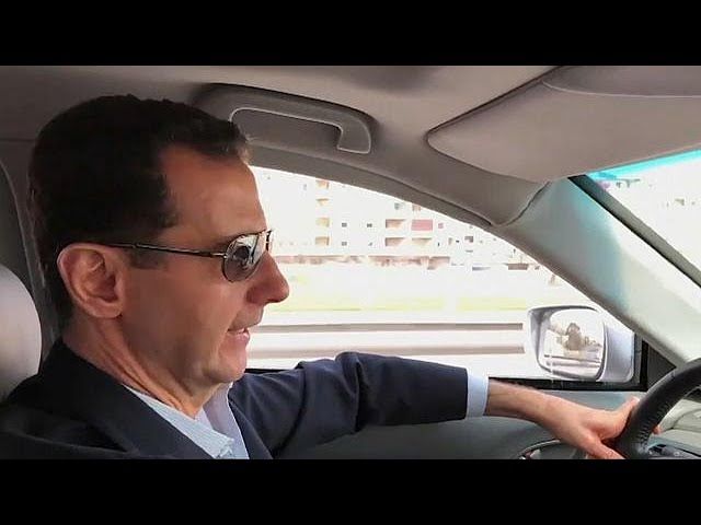 President Bashar al-Assad filmed driving himself to the Syrian civil war's front line